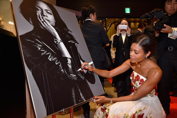 TOKYO, JAPAN - NOVEMBER 30: Naomie Harris signs her autograph on a poster during the event celebrating the OMEGA SPECTRE Japan release on November 30, 2015 in Tokyo, Japan. (Photo by Koki Nagahama/Getty Images for OMEGA) *** Local Caption *** Naomie Harris